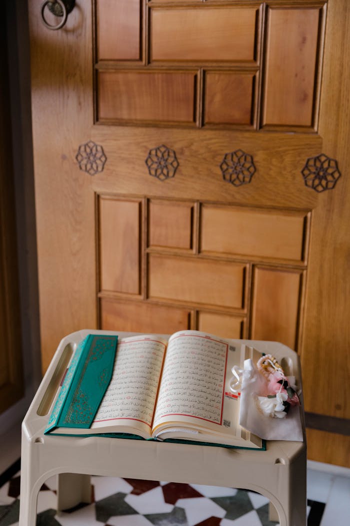 The Art of Drawing Readers In: Your attractive post title goes here Open Quran placed elegantly on a stand in a peaceful indoor setting.
